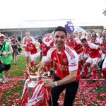 london-england-mikel-arteta-manager-of-arsenal-celebrates-with-the-premier-league-trophy-as_munjjxwx.jpeg